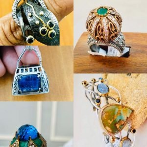 silver rings and necklaces in the finger