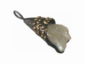 a silver made baraque pendant