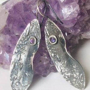 silver earrings with leaf design two small amethyst stones