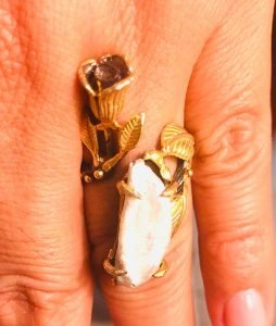 pearl silver ring in a woman's left finger