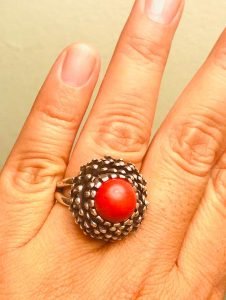 red coral silver 925 ring in a woman's finger