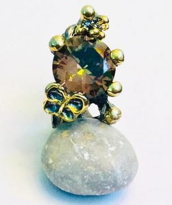 zultanite ring on the rock stone