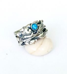 silver ring with blue australian opal stone on the white stone