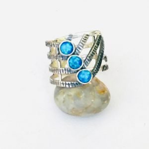 blue color australian opal ring on a grey small stone