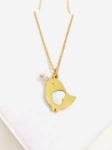a pigeon necklace gold color with its gold chain