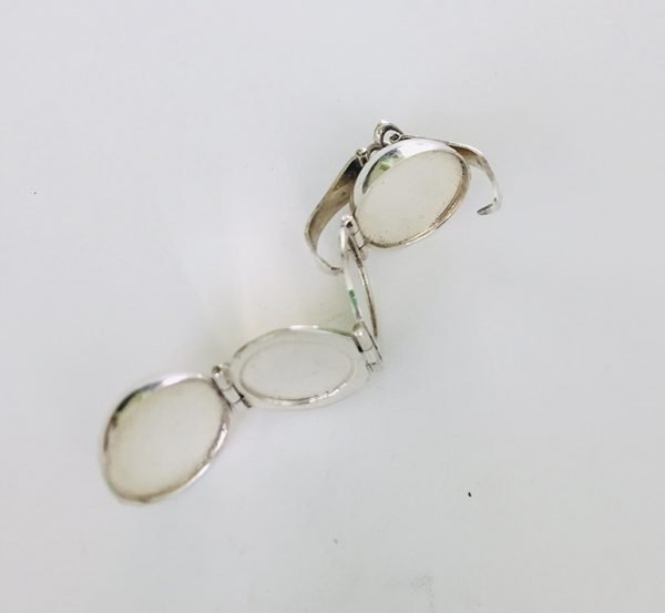 side view silver made pendant women