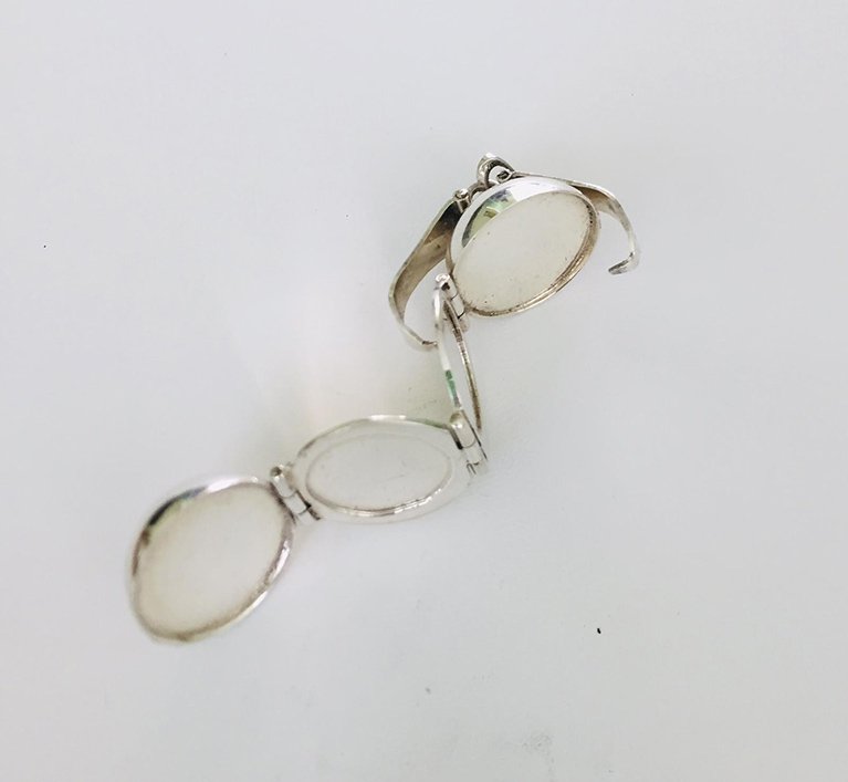 side view silver made pendant women