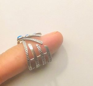 sterling silver ring in a woman's finger