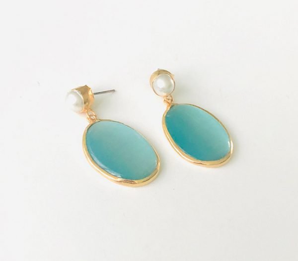 a pair of light blue earrings