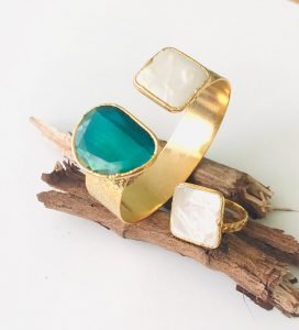 a bracelet and ring set with pearl stones