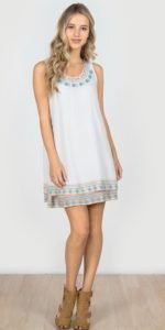 girl wearing a bohemian white short dress
