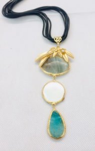 a gold plated turkish necklace with three stones