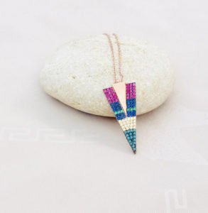 a pendant on the cream color stone