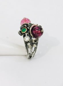 a floral design ring with small stones