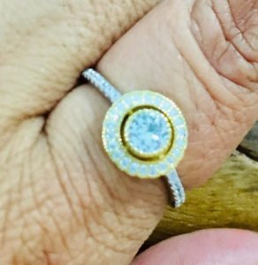 gold ring in the woman finger