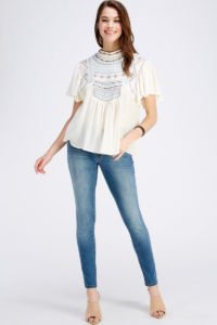 young beautiful model wearing beige color blouse