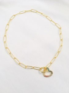 gold plated heart necklade in white background