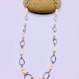 freshwater cultured pearl necklace displaying on a stone