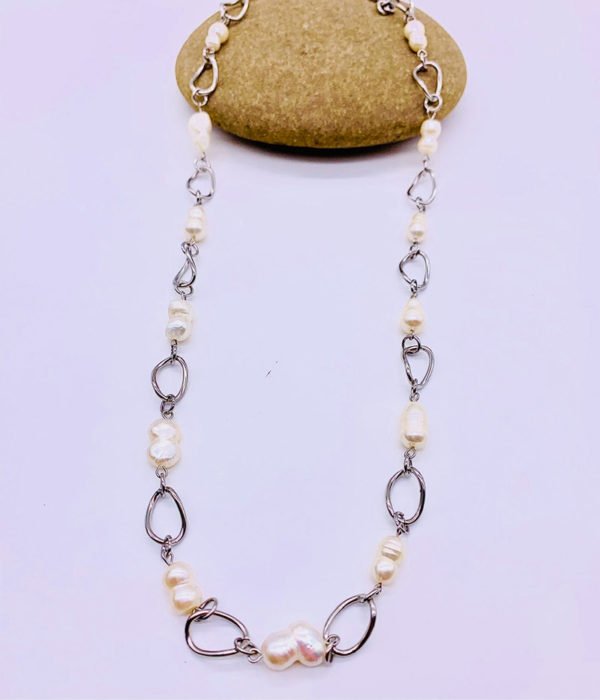 freshwater cultured pearl necklace displaying on a stone