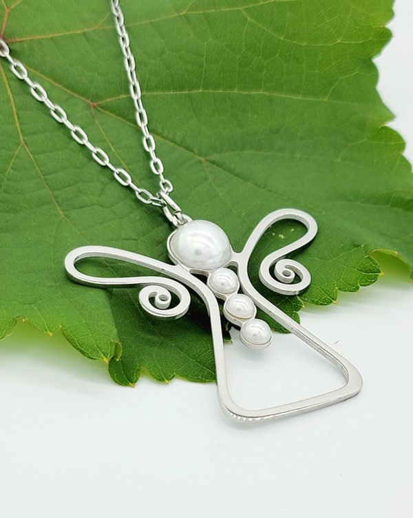 silver guardian angel on a green leaf displaying