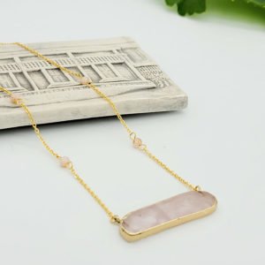 a pink quartz stone gold color chain necklace