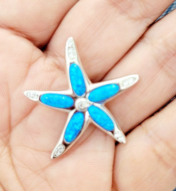 starfish pendant on a woman's palm