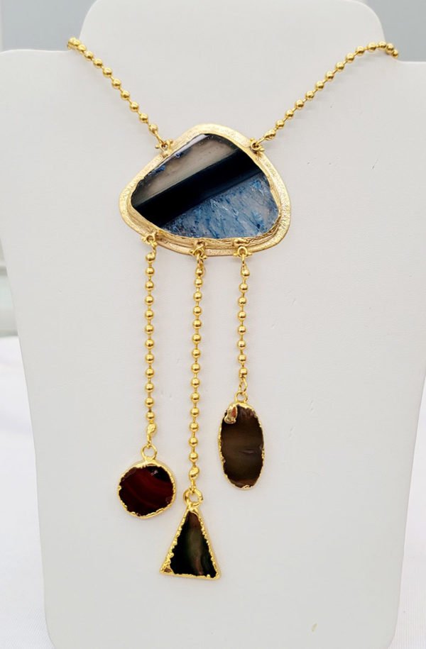 a blue agate stone necklace displaying