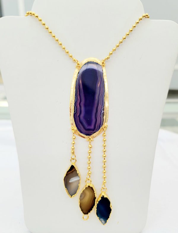 a purple agate stone necklace made in gold