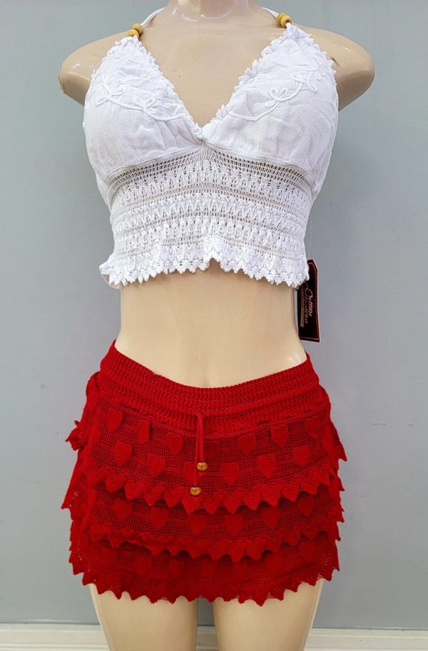 white top displaying with a red skirt